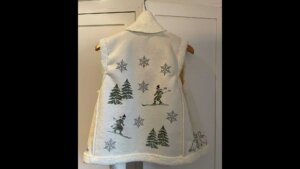 Vinterlig vest med skikjører og snøfnugg, perfekt for kalde dager. Tykk og koselig design for varme og stil.